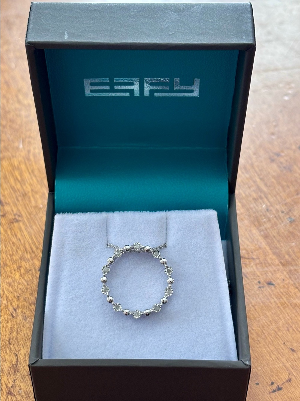 Effy Diamond Circle Pendant Necklace with a round pendant of 10 white diamonds